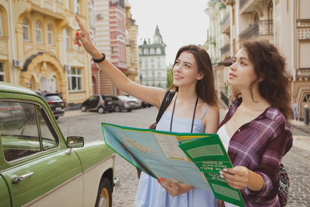 Female friends traveling together, sightseeing in the town