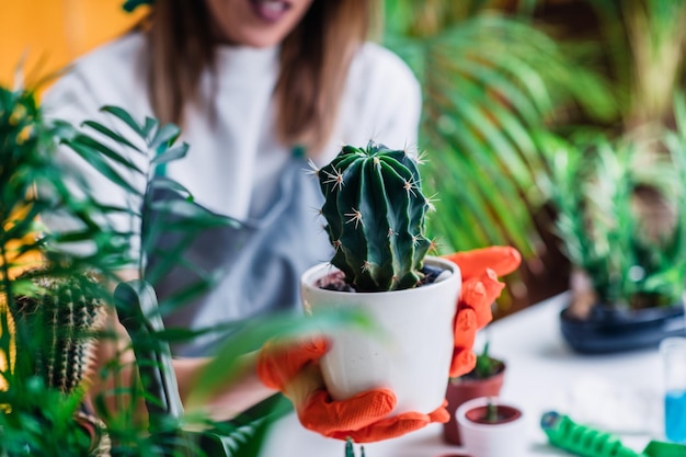 Female Gardener Holding a Potted Plant