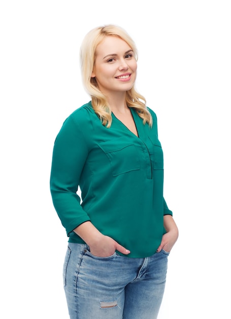 female, gender, portrait, plus size and people concept - smiling young woman in shirt and jeans