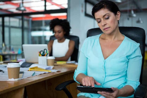 Female graphic designer using digital tablet