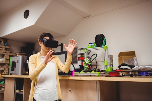 Female graphic designer using the virtual reality headset