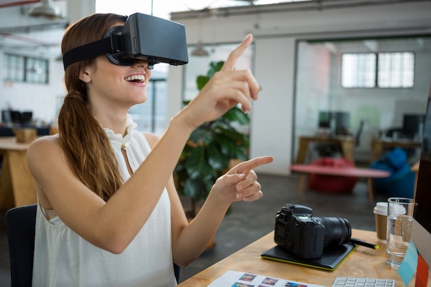 Female graphic designer using the virtual reality headset