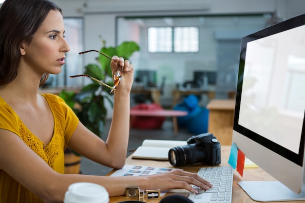 Female graphic designer working on computer