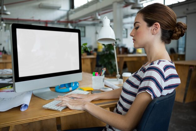 Female graphic designer working on computer