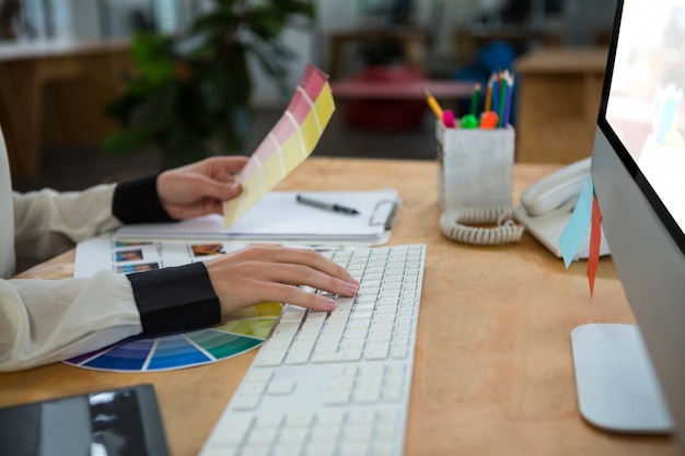 Female graphic designer working at desk