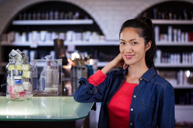 Female hairdresser standing at a table in salon