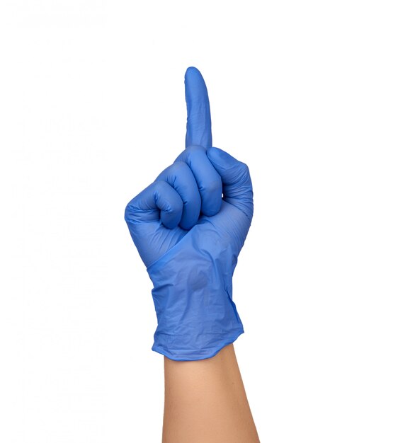 Female hand in a blue medical sterile glove shows a gesture, the index finger is raised up