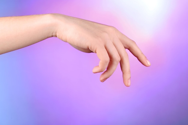 female hand on colorful background