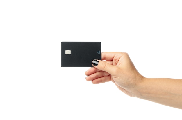 Photo female hand hold black card isolated on white