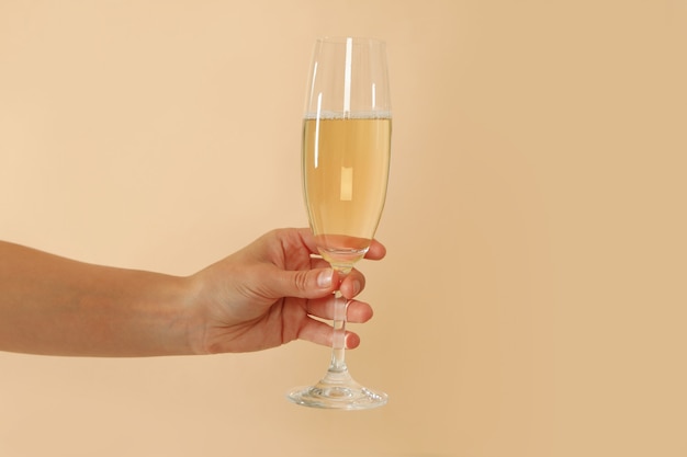 Female hand hold champagne glass