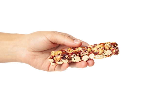 Female hand hold granola bar, isolated on white background
