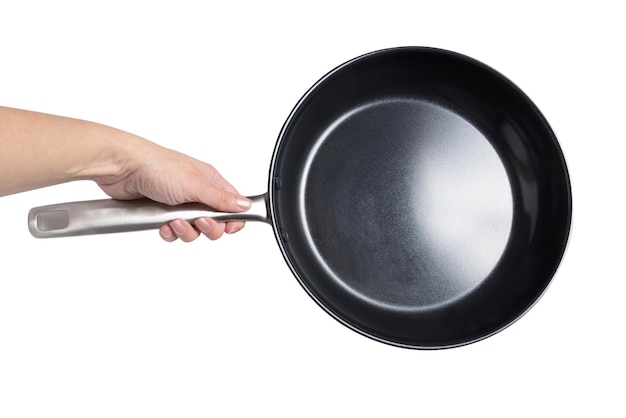 Female hand holding female hand holding nonstick frying panfrying pan