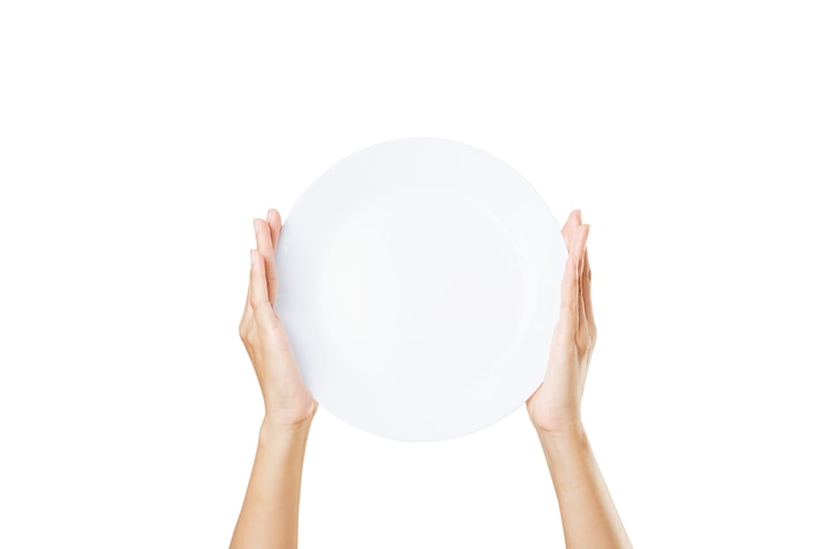 Photo female hand holding a plate