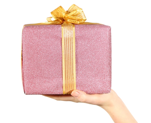 Female hand holding present box with ribbon on light background