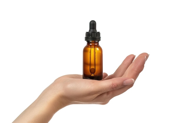 Female hand holds amber glass bottle for skincare or essential oil