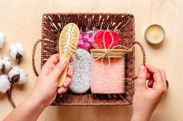 Female hand holds care box Set of eco - friendly cosmetics