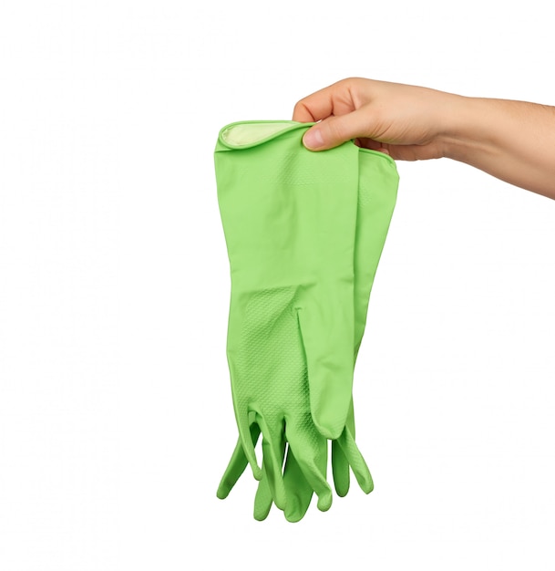 Female hand holds green rubber gloves for cleaning