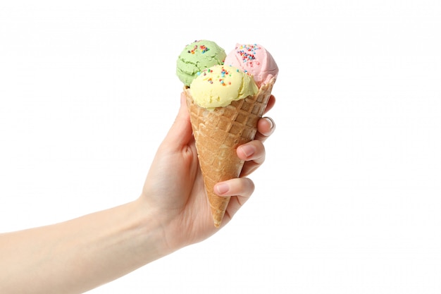 Female hand holds ice cream, isolated on white surface