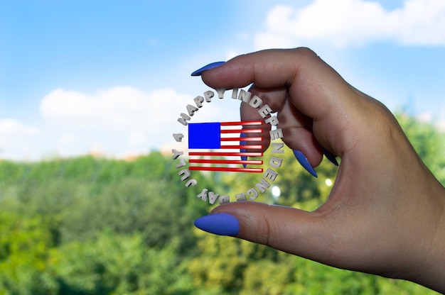 Female hand holds Independence Day icon