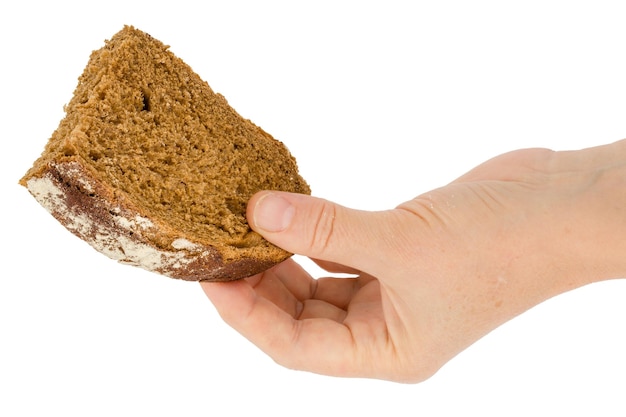 Female hand holds a slice of bread isolated on white background