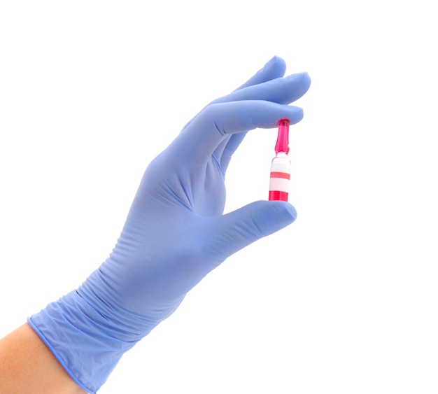 Female hand in medical gloves holding test tube of vaccine