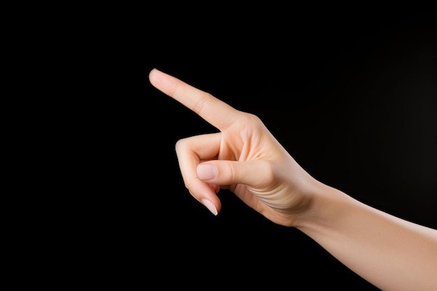 Female hand pointing upwards on isolated black background