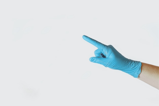 Female hand in rubber glove on white background