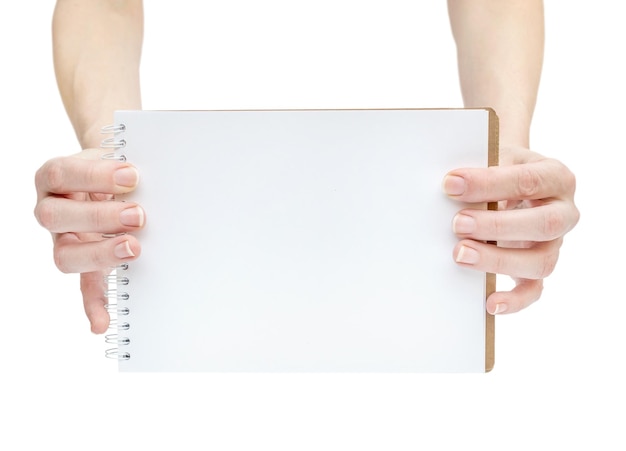 Female hand showing empty notepad Isolated on white