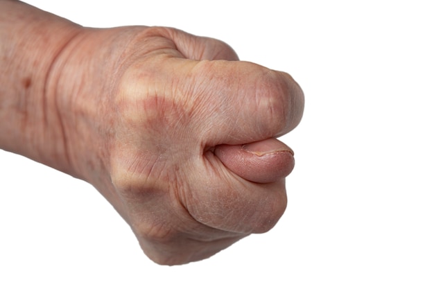 Female hand shows a fig fist, a symbol of rejection