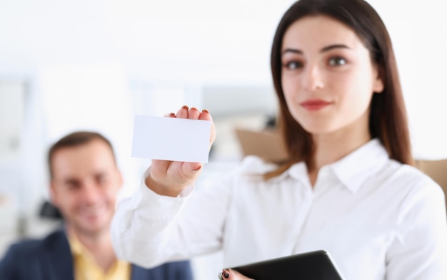 Female hand in suit give blank calling