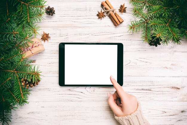  Female hand touch screen of tablet, top view