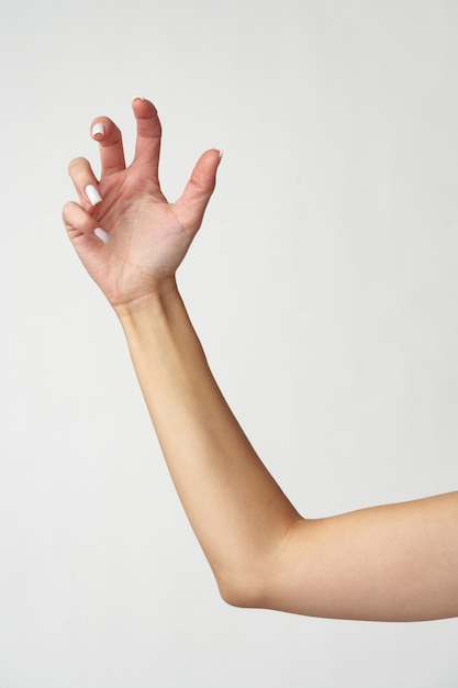 Female hand on white background close up