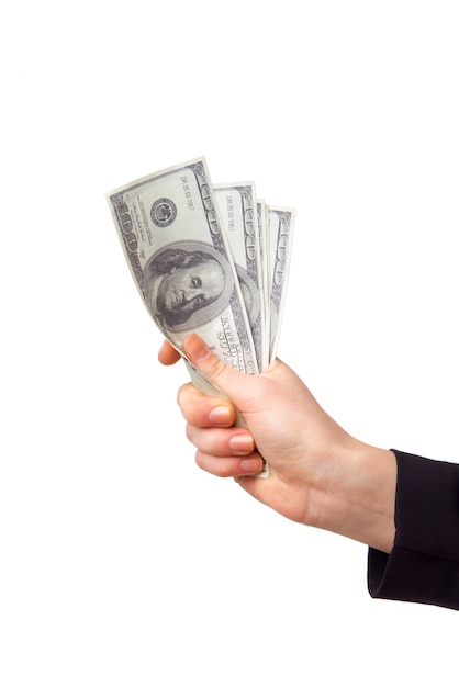 Female hand with money isolated on a white background