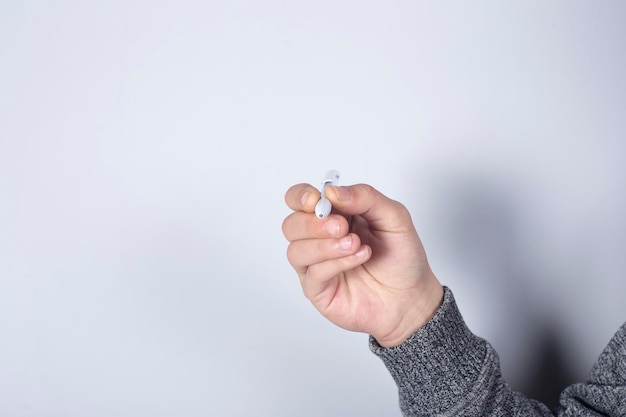 Female hand with pen on white background