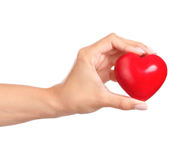 Female hand with red heart isolated on white