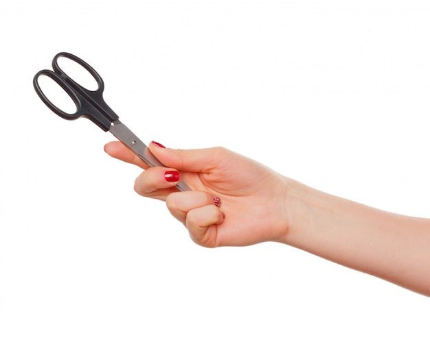 Female hand with scissors isolated on white