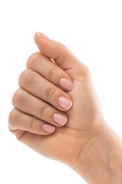 Female hand with soft skin and beautiful french manicure on white background