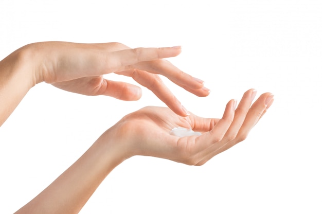 Female hands applying moisturiser