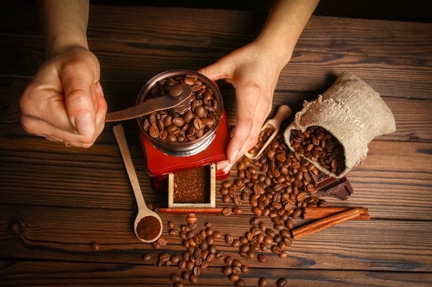 A female  hands and coffee grinder
