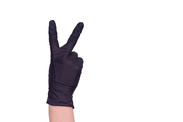 手袋をはめた女性の手。医療テーマ。コロナウイルスパンデミック