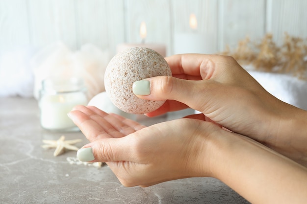 Female hands hold bath ball, close up