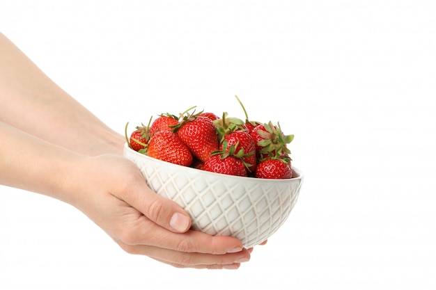 Female hands hold bowl with tasty strawberry