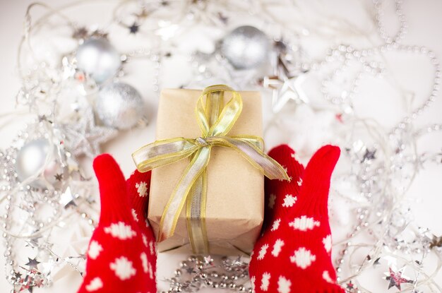 Female hands hold a Christmas gift