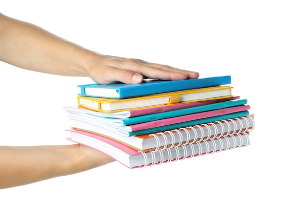 Female hands hold copybooks, isolated on white background