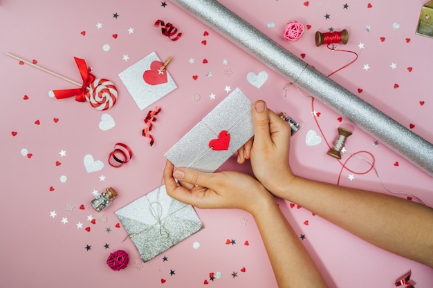 Female hands hold a love letter in an envelope