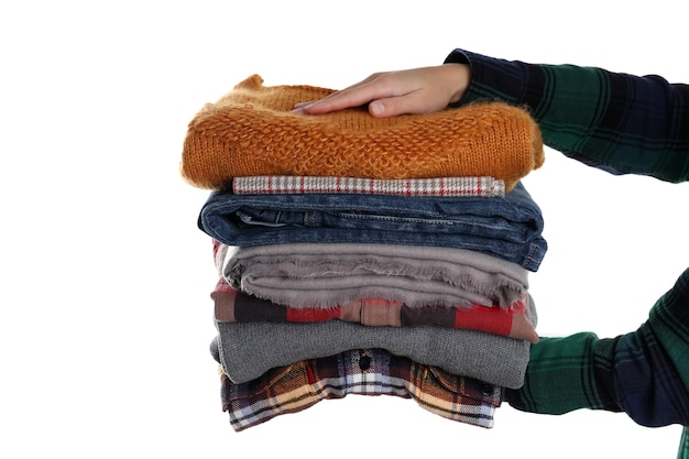 Female hands hold winter clothes, isolated on white background.