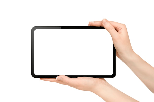 Female hands holding digital tablet on isolated white wall