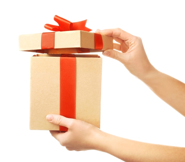 Female hands holding gift box, closeup