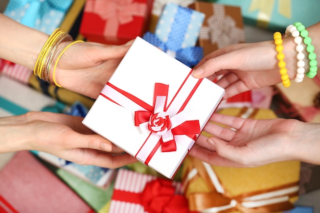 Female hands holding gift close-up