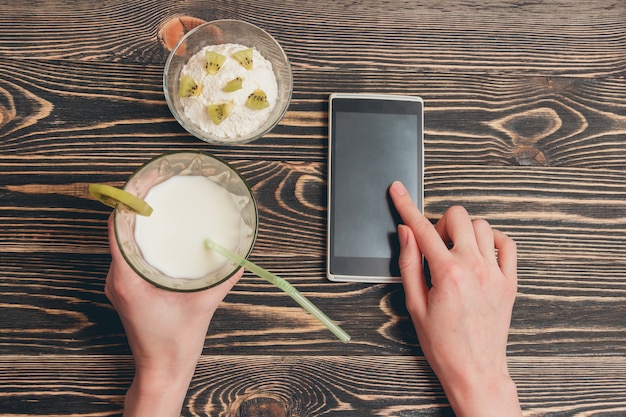 Female hands holding smartphone